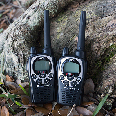 MIDLAND<sup>&reg;</sup> GXT1000VP4 Pro Series Two-Way Radios - Stay in contact for up to 36 miles with this pair of maximum powered walkie talkies. Radios offer NOAA Weather Alert radio, SOS Siren, group call,  vibrate alert and silent calling, eVOX hands-free operation, 22 channels with 28 extra channels, 142 privacy codes and much more. Package also includes belt clips, pair of boom mic headsets, desktop charger, rechargeable batteries, AC wall adapter and DC adapter.
